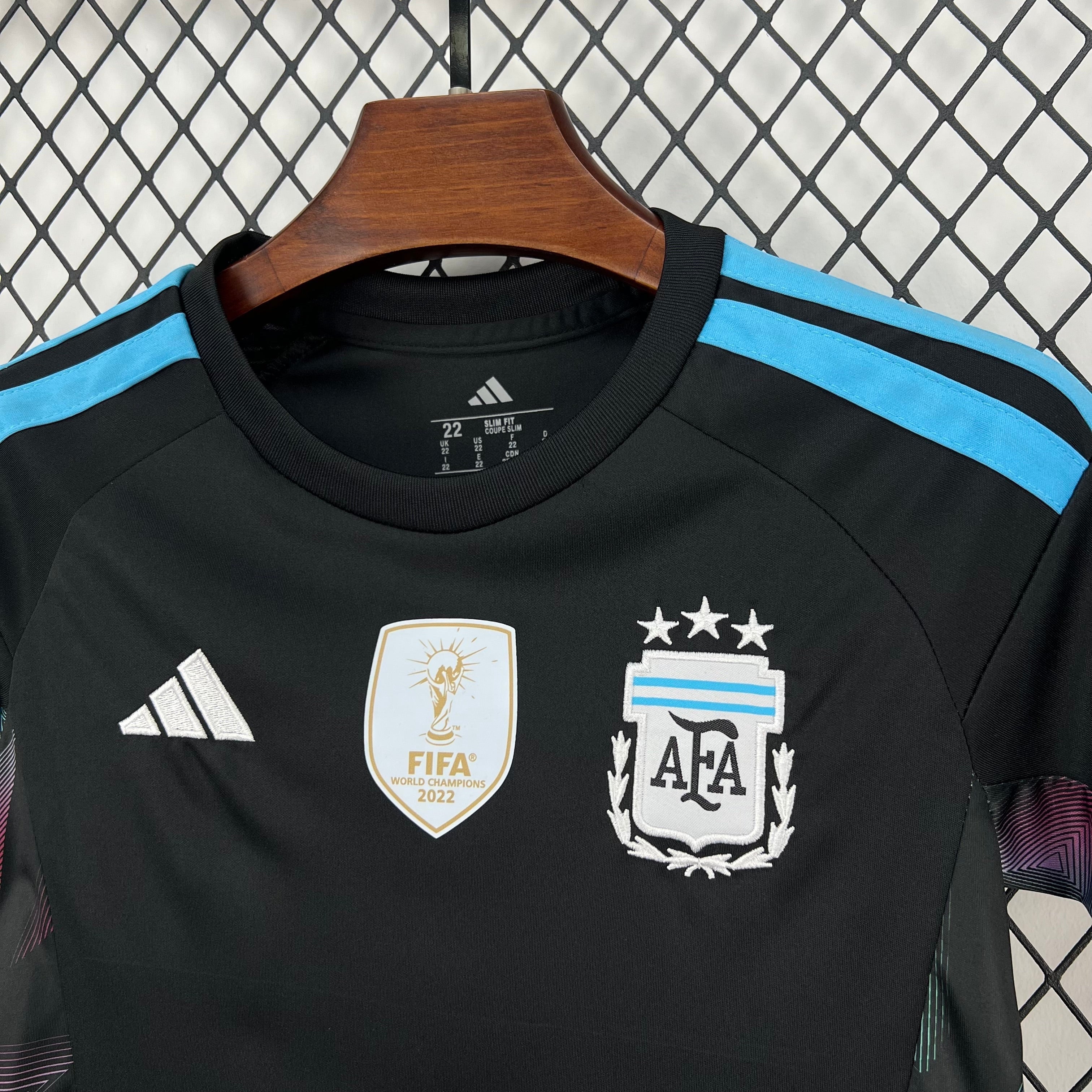 Leazofoot black child's goalkeeper jersey with light blue accents and FIFA World Champions 2022 badge.