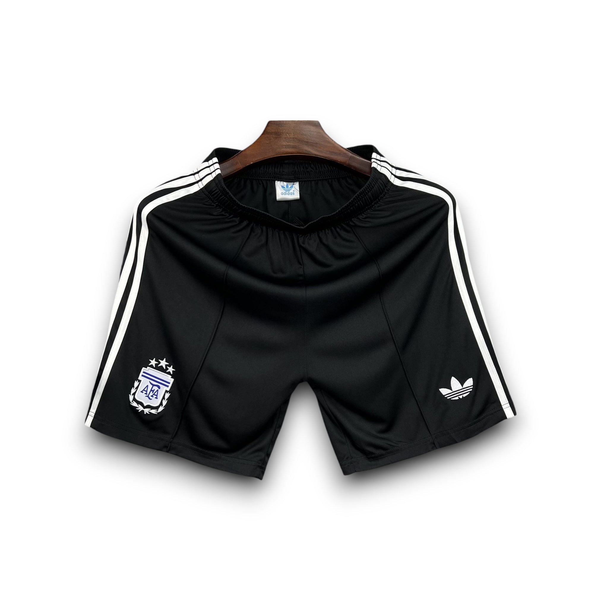 Leazofoot Argentine black soccer shorts with white Adidas stripes and crest. 2026 exterior.