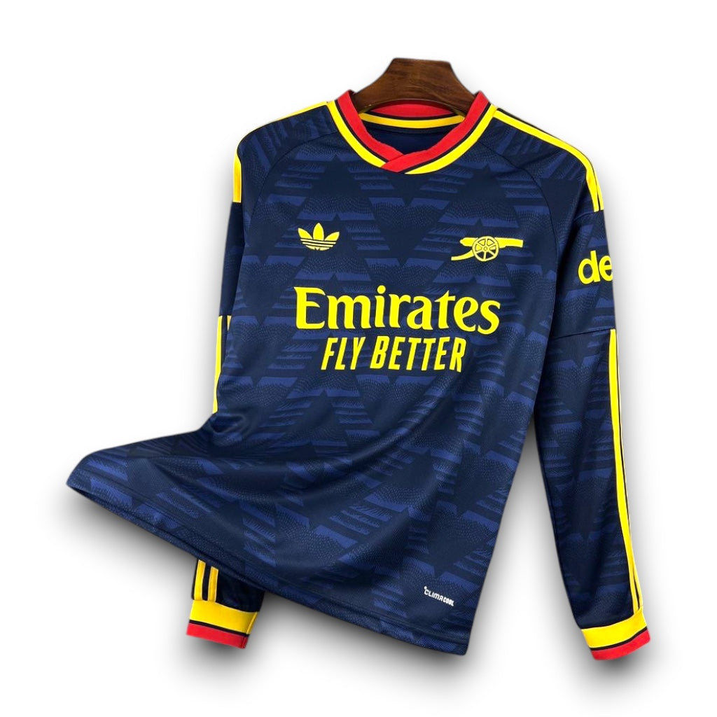 Leazofoot Arsenal 26/27 long sleeve away football jersey in dark blue with yellow and red trim details.