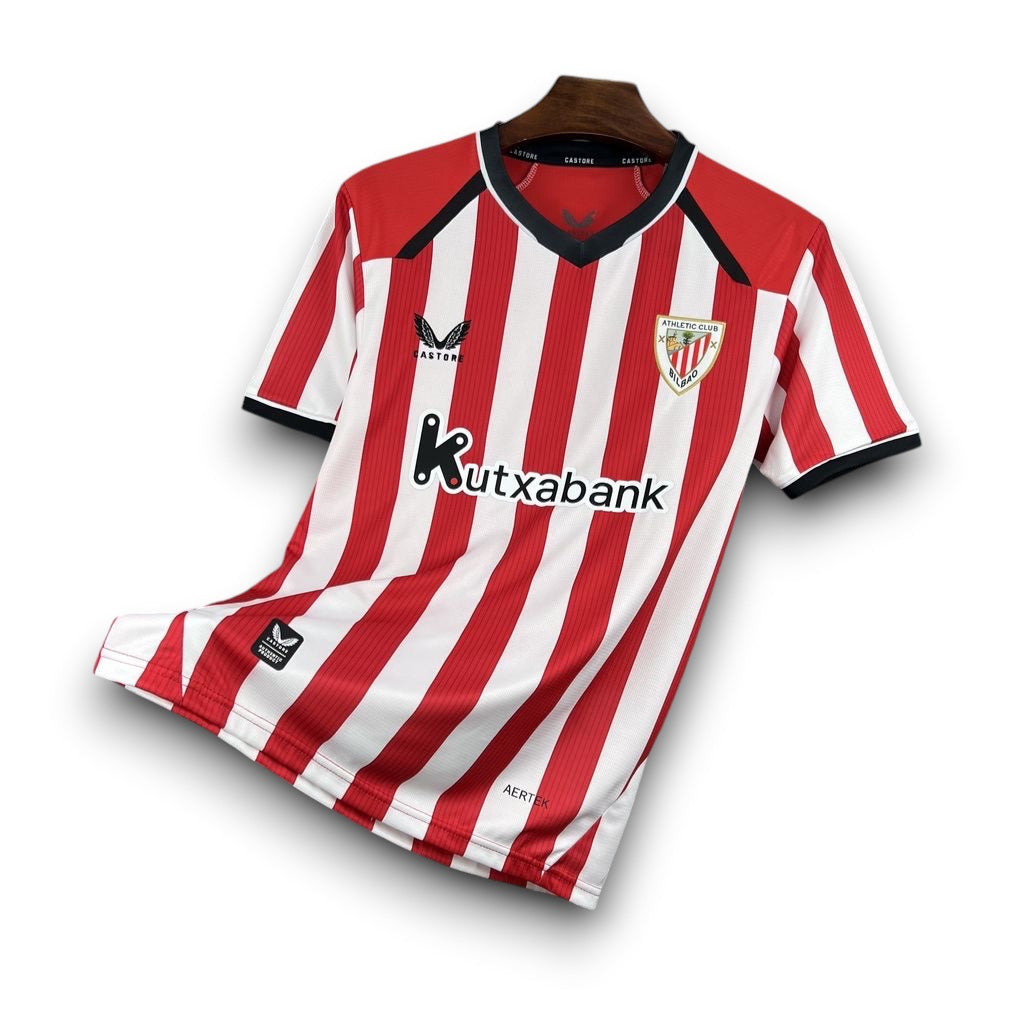 Leazofoot Athletic Bilbao 26/27 home jersey with red and white stripes, black V-neck, and club crest on a hanger.