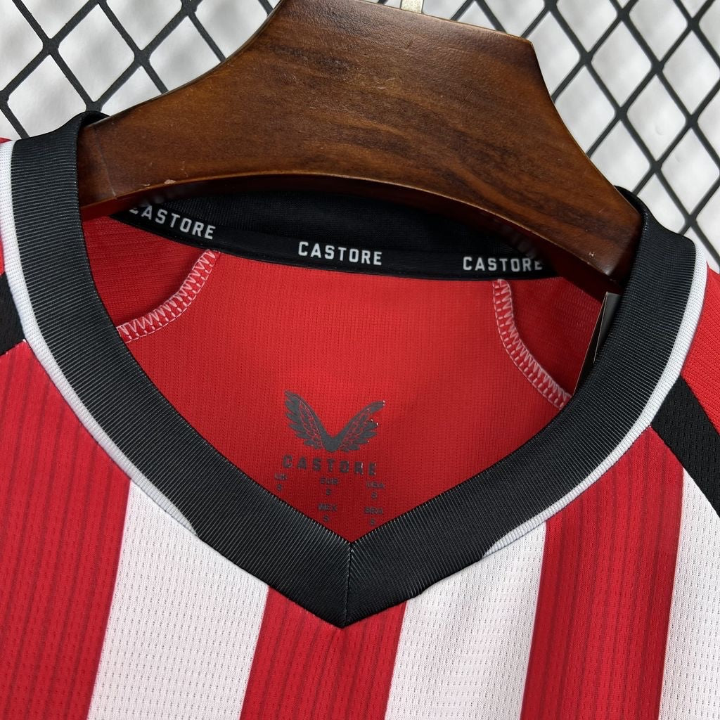 Leazofoot Athletic Bilbao 26/27 home jersey featuring red and white stripes, black V-neck collar, and Castore branding.