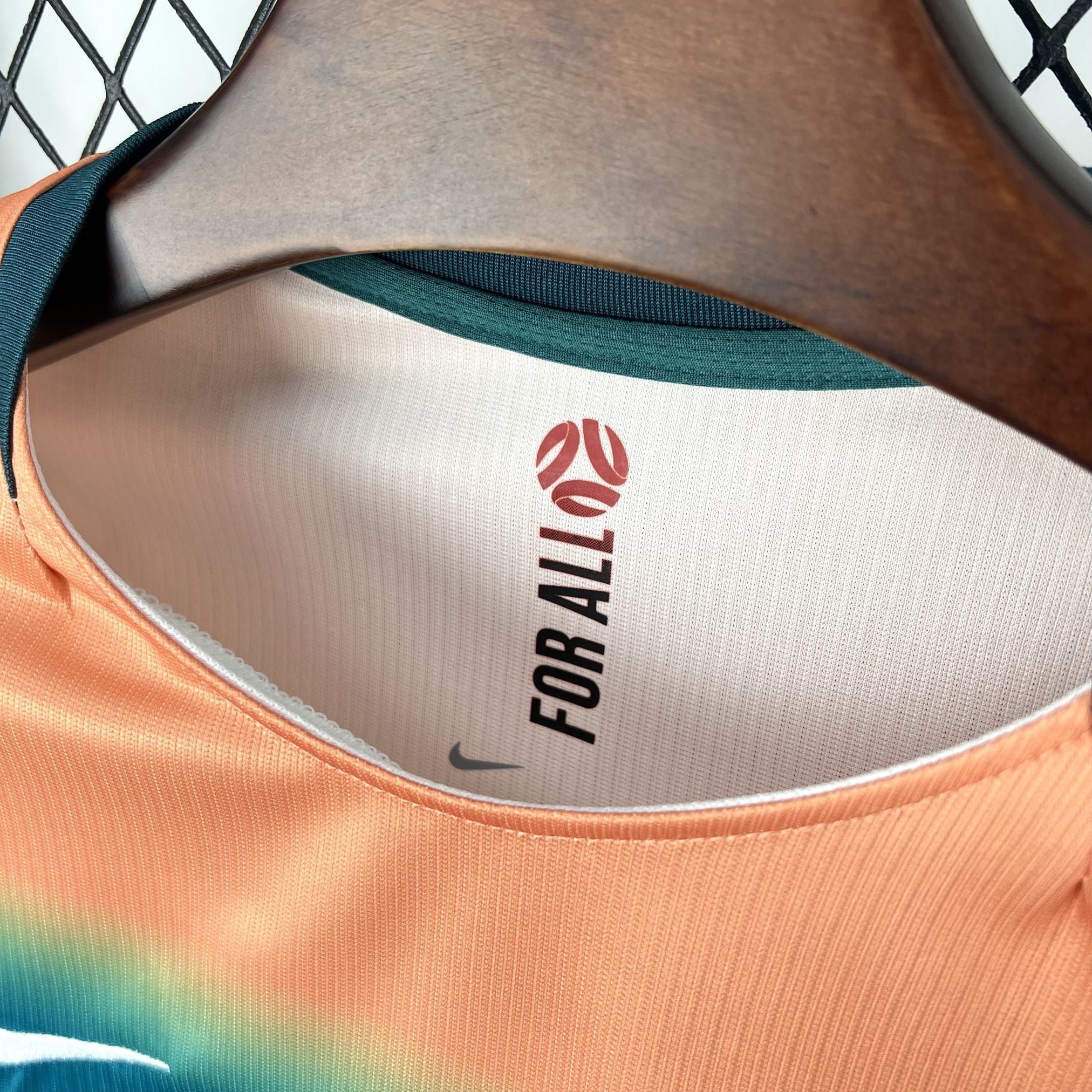 Leazofoot AUSTRALIE 2026 away jersey with "FOR ALL" graphic and Nike logo. Orange and teal gradient.