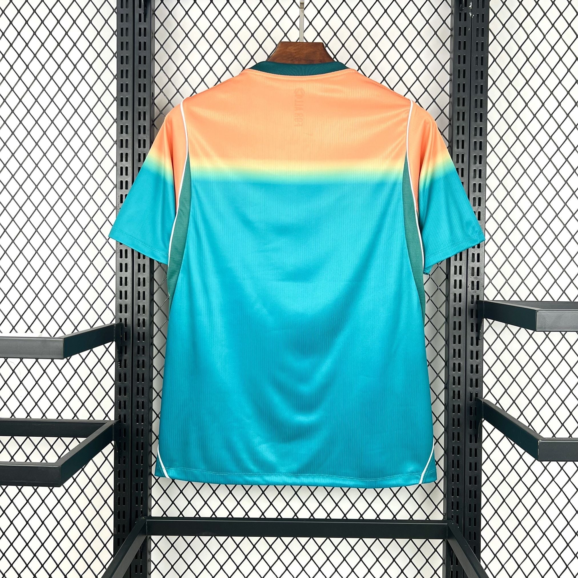 Leazofoot AUSTRALIE 2026 away jersey with a gradient of teal to orange on the upper back and sleeves.