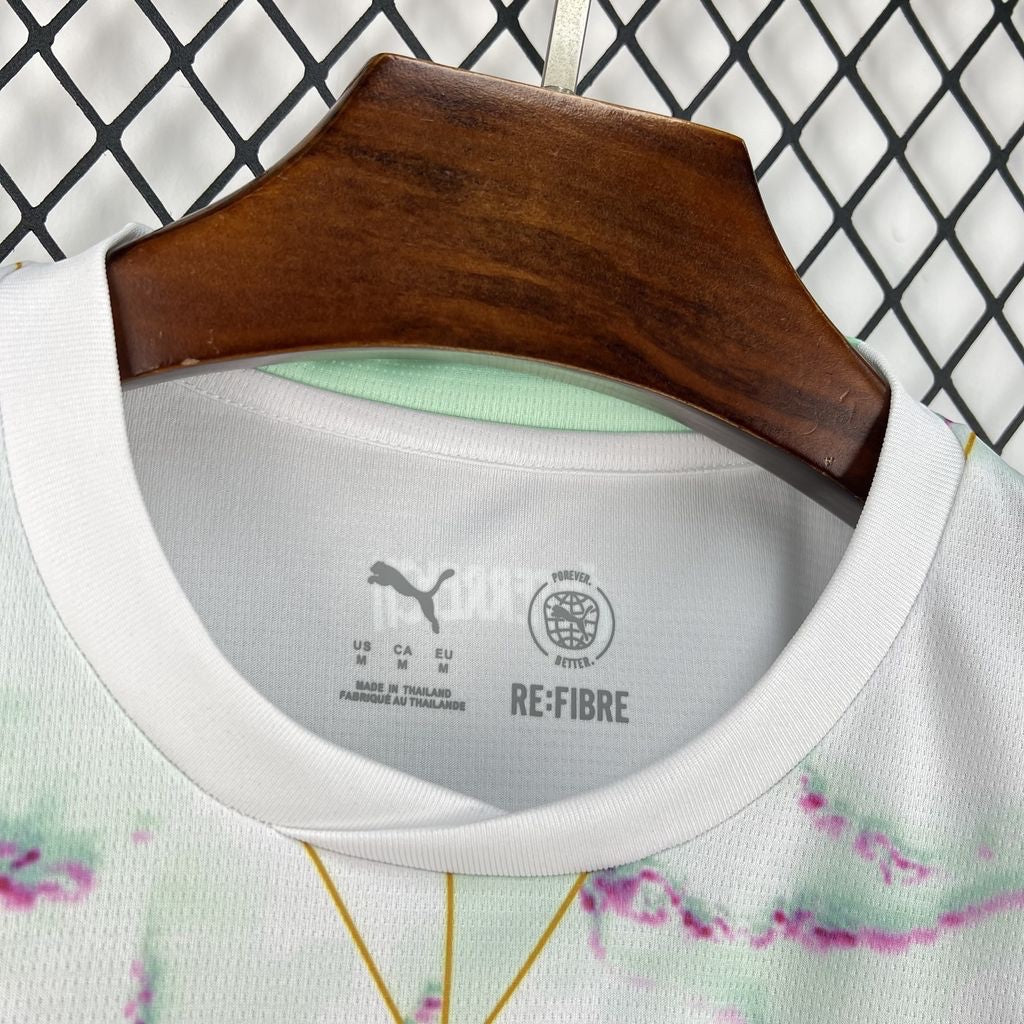 Leazofoot Austria 2026 away soccer jersey in white with abstract green and purple pattern and Puma RE:FIBRE branding.