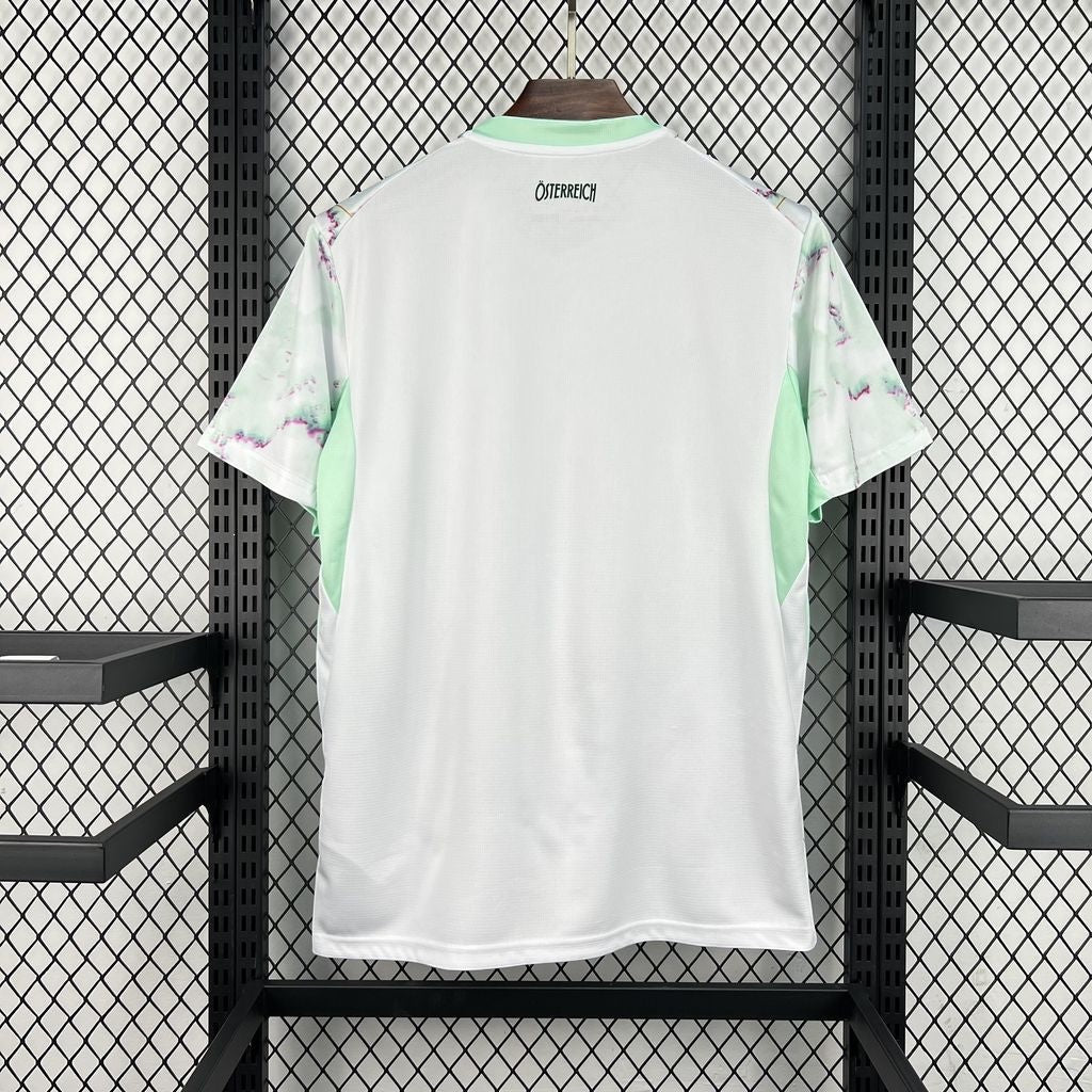 Leazofoot Austria 2026 away soccer jersey in white with light green accents and patterned sleeves on a hanger.