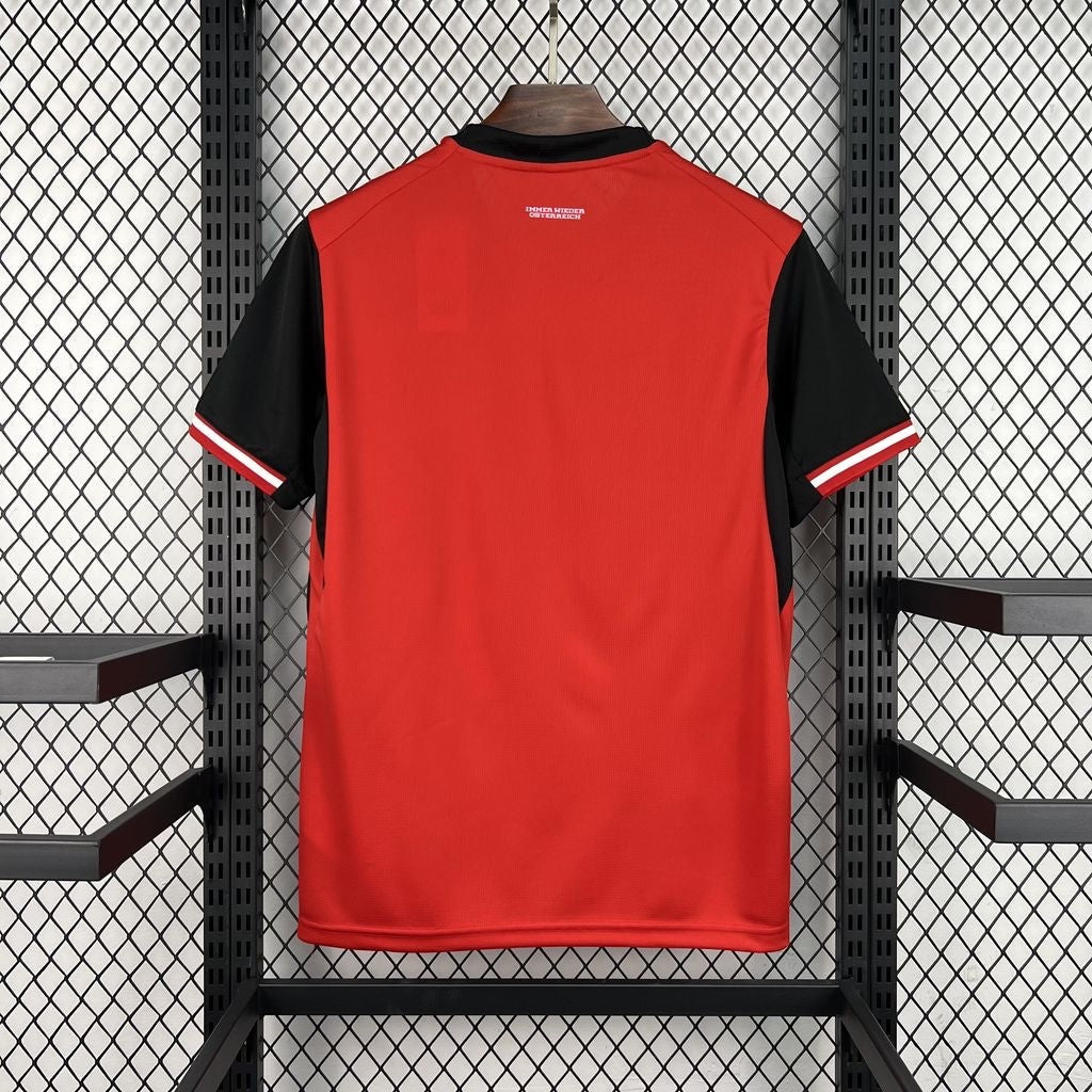 Back view of Leazofoot Austria 2026 home soccer jersey in red with black sleeves and white trim details.