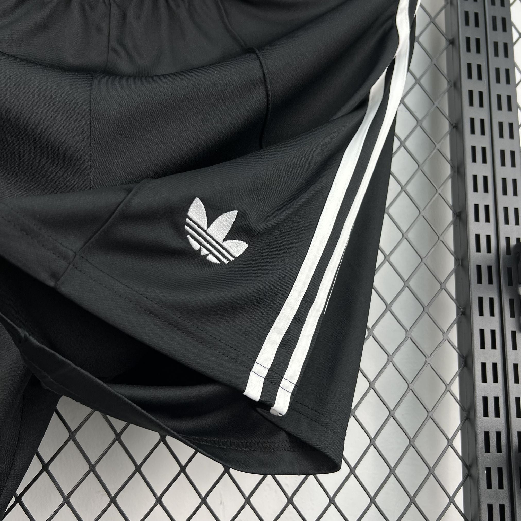 Leazofoot black athletic shorts with white Adidas stripes and trefoil logo.