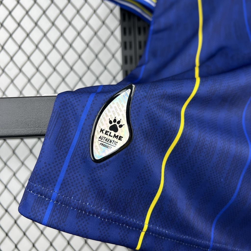 Leazofoot BOSNIE 2026 home jersey in dark blue with yellow and blue vertical stripes and authentic KELME logo.