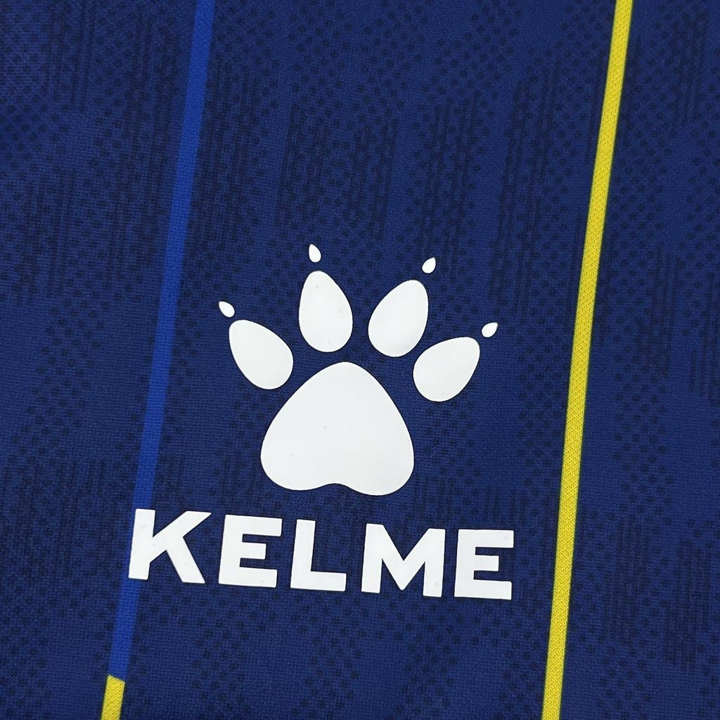 Leazofoot BOSNIE home jersey 2026, dark blue with subtle pattern, white paw logo and yellow stripe detail.