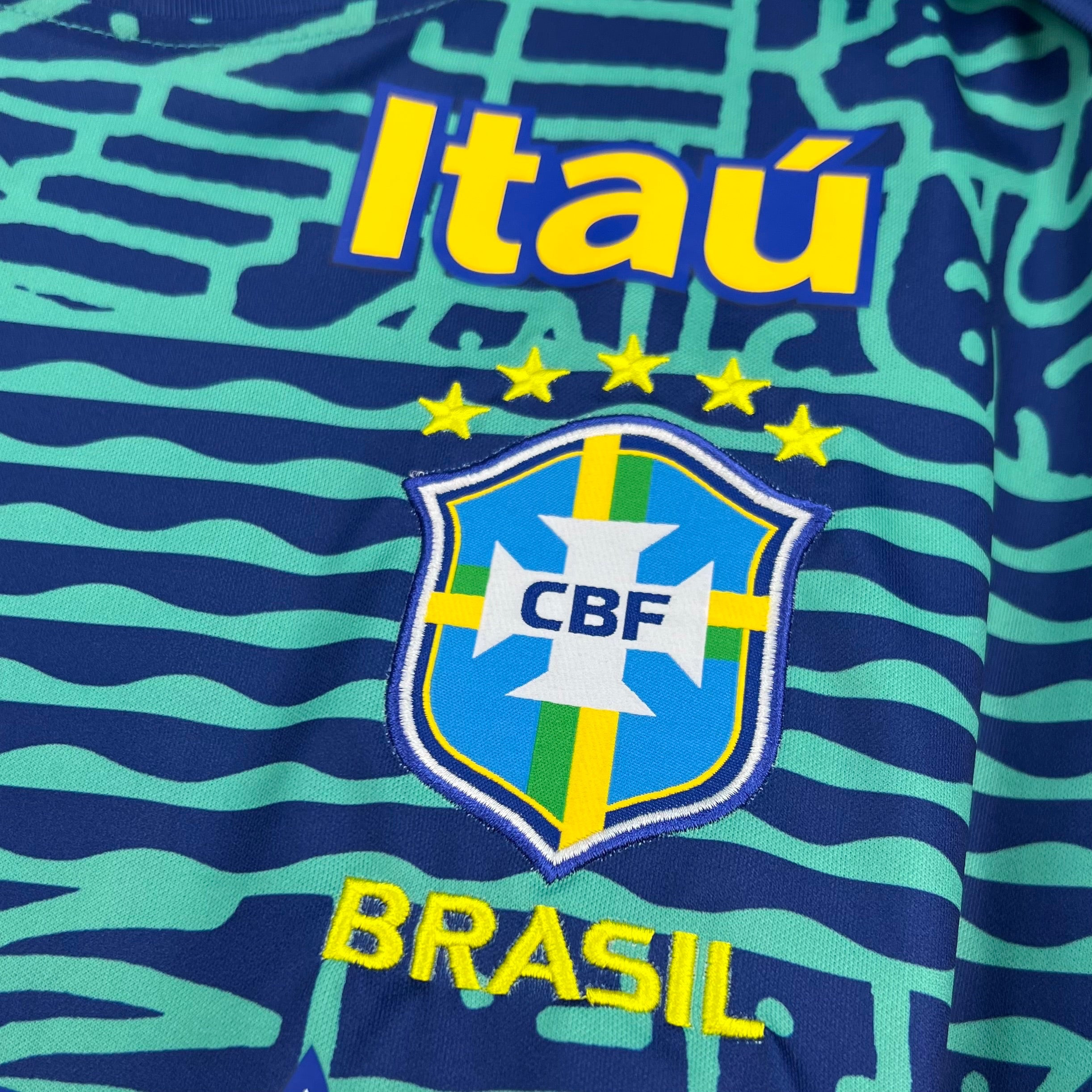 Leazofoot Brazil national football team pre-match jersey with blue and green wavy pattern, CBF crest, and Brasil text.