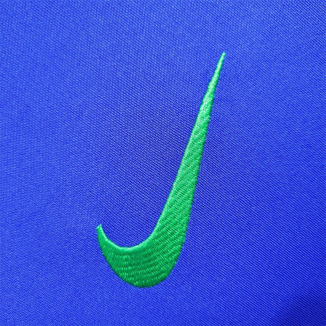 Leazofoot Brazil 2022 away jersey featuring a vibrant green embroidered Nike swoosh on a royal blue fabric background.