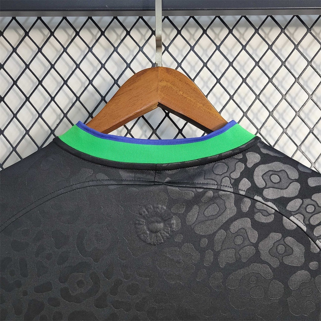 Leazofoot Brazil 2023 concept soccer jersey in black with a tonal leopard print pattern and green and blue collar.