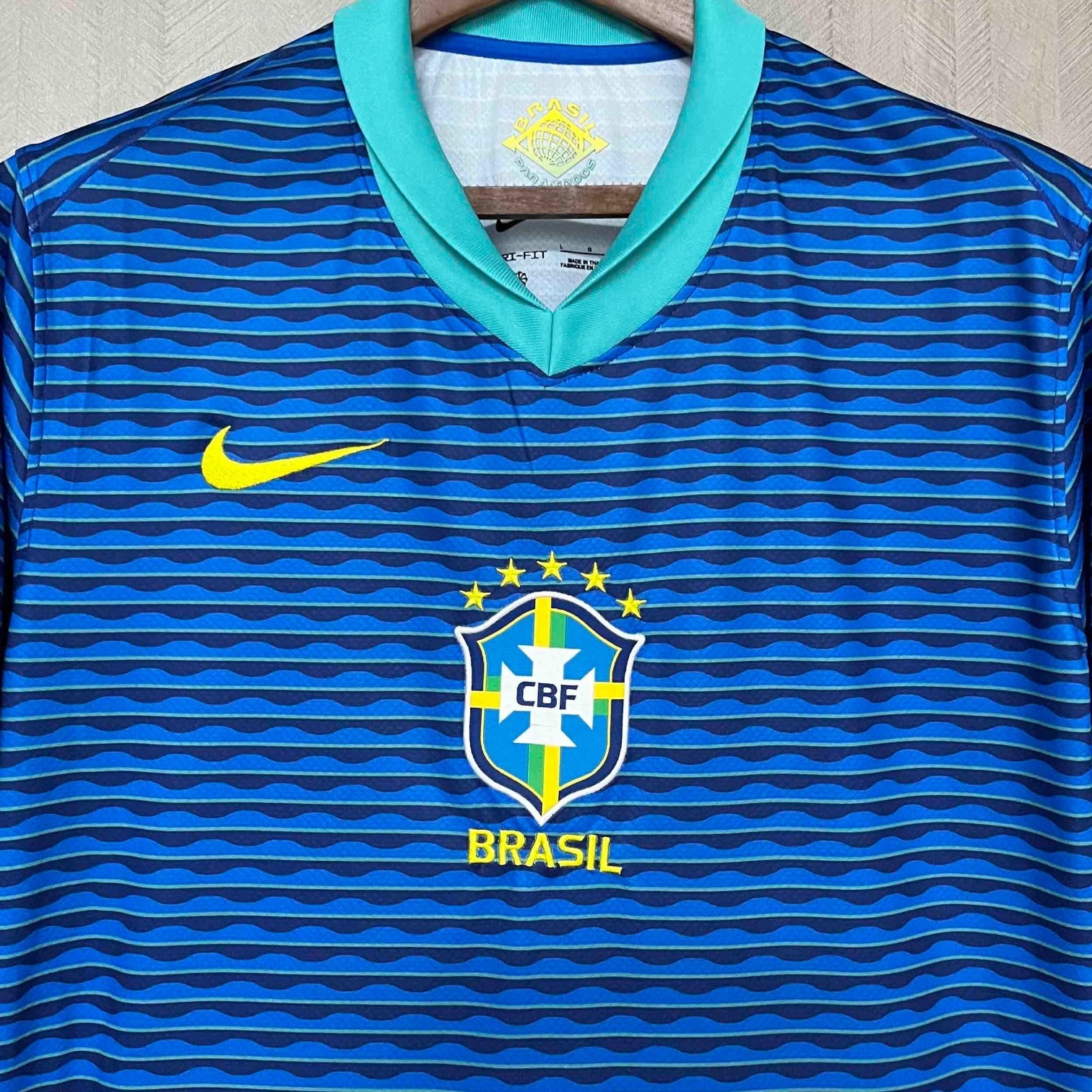 Leazofoot 2024 Brazil away soccer jersey in blue with wavy horizontal stripes, yellow Nike swoosh, and CBF crest.