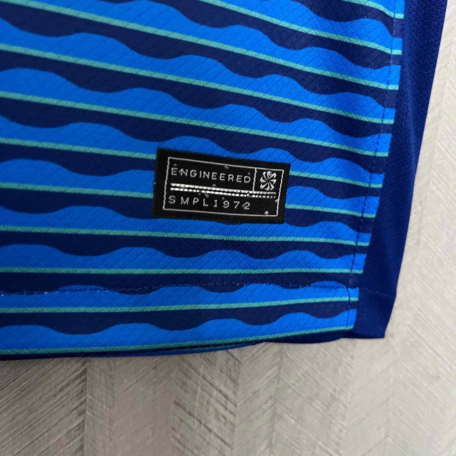 Leazofoot Brazil 2024 away jersey featuring blue and teal wavy striped pattern with an engineered authentic label.