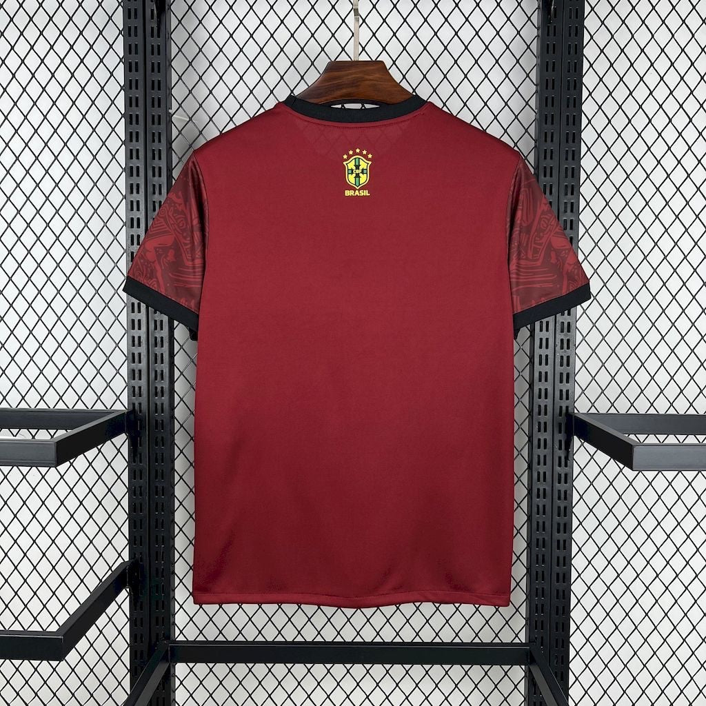 Leazofoot maroon Brazil 2024 concept soccer jersey with black trim and CBF crest on a wire rack display.