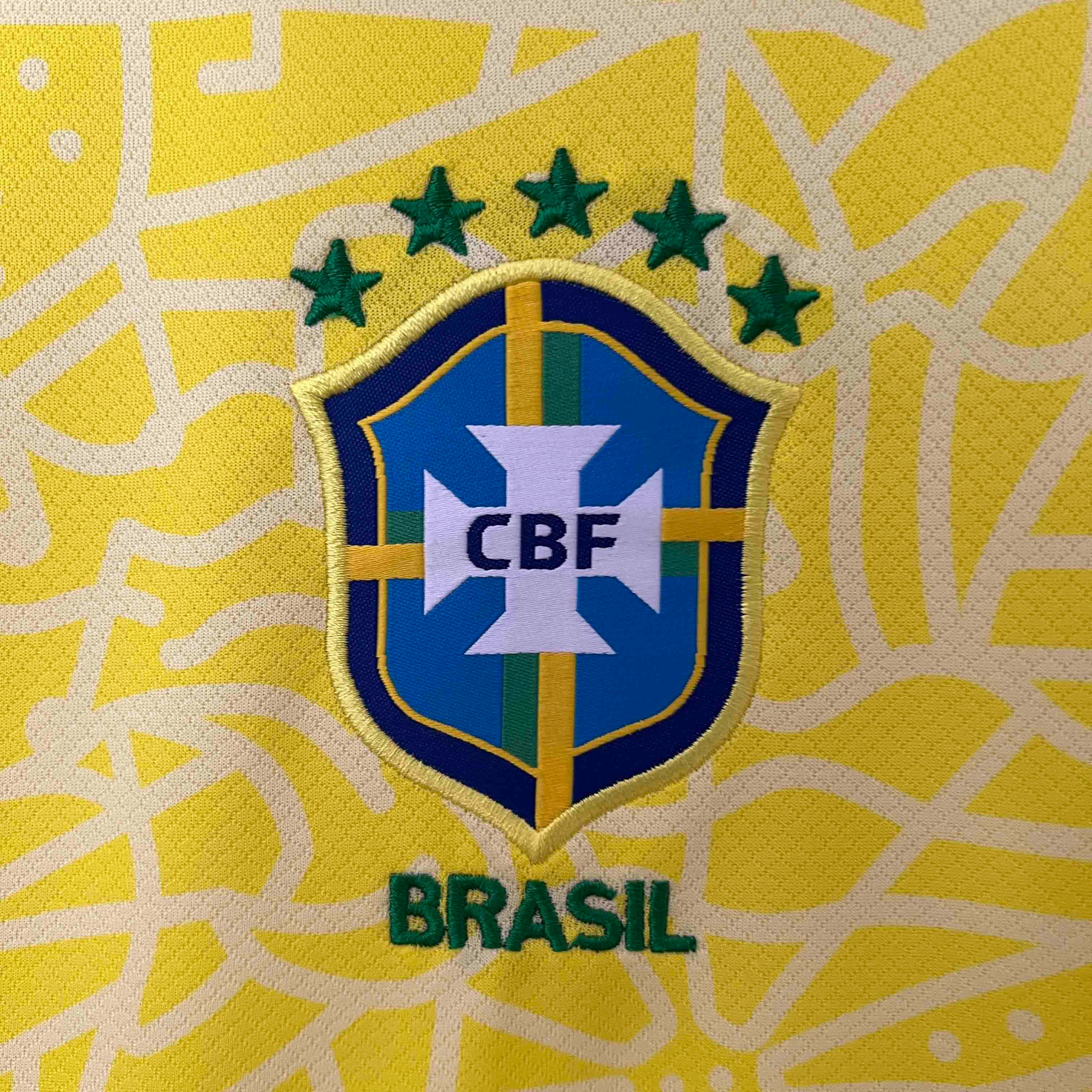 Leazofoot Brazil 2024 home jersey featuring the embroidered CBF crest and five green stars on a yellow patterned fabric