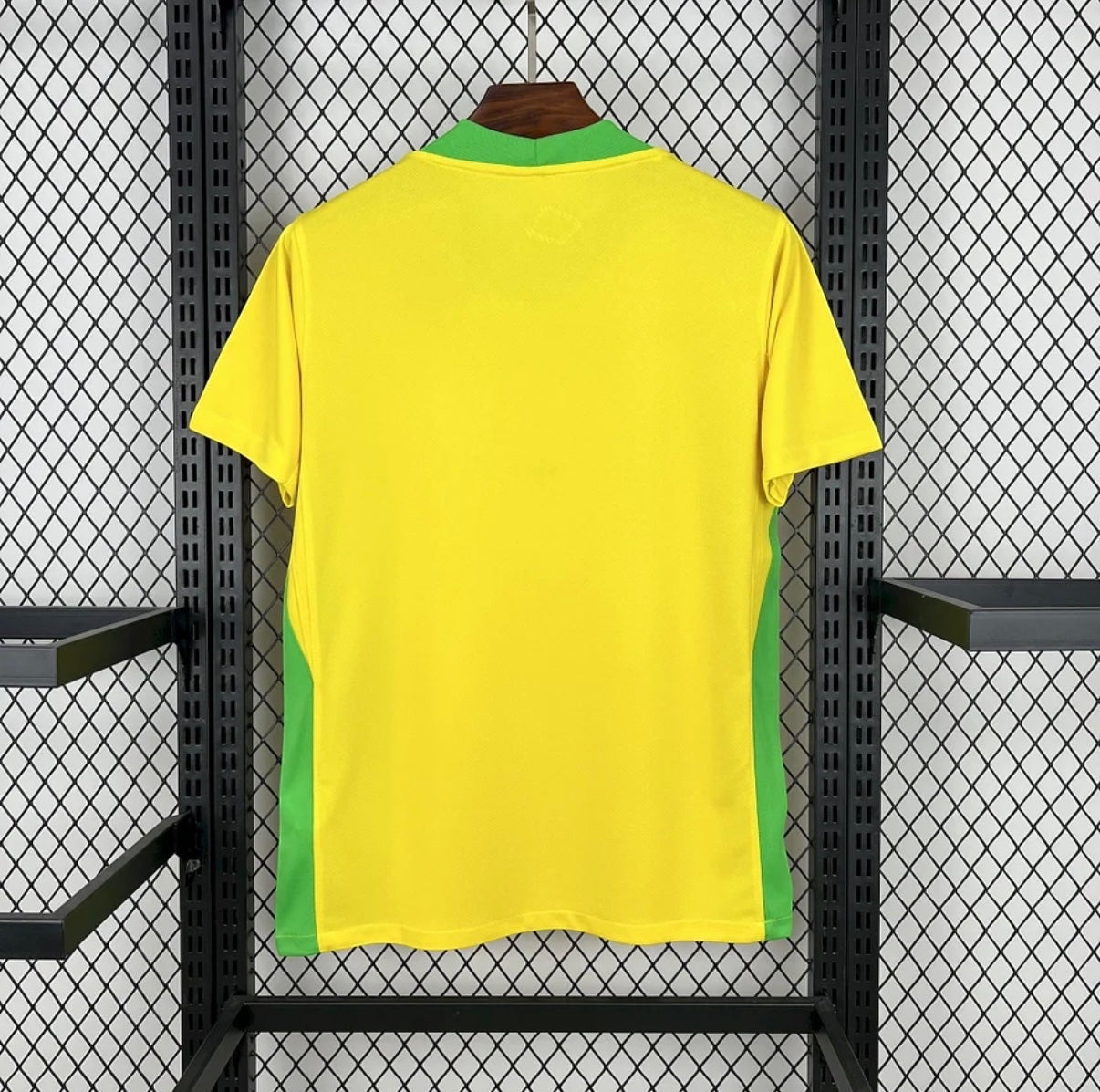 Leazofoot 2025 Brazil home football jersey in yellow with green collar and side panel details on a hanger.