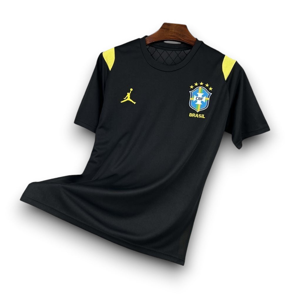 Leazofoot black Brazil 2026 pre-match football jersey with yellow accents on shoulders and logos.