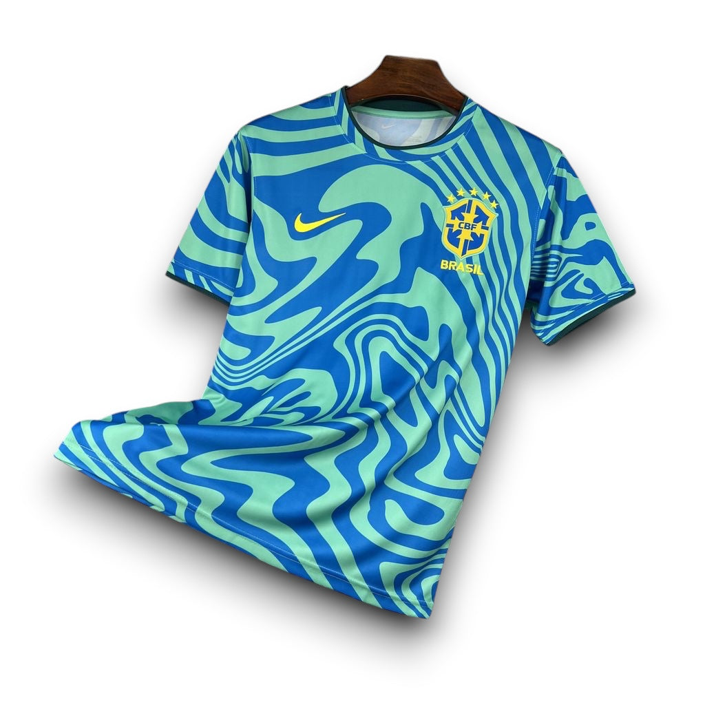 Leazofoot Brazil 2026 pre-match soccer jersey featuring a blue and green wavy pattern with team crest and Nike logo.