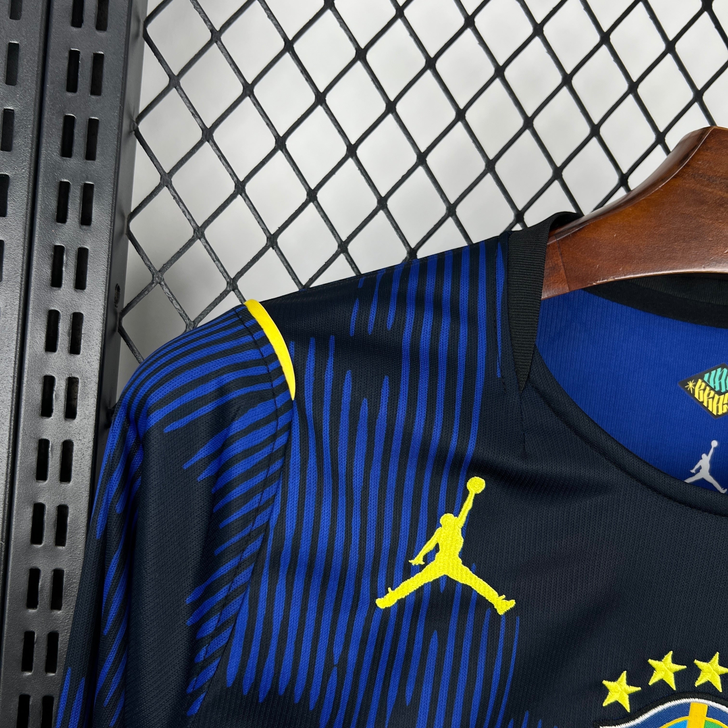 Leazofoot black long-sleeve soccer jersey with blue vertical stripes and yellow accents. Features Jordan logo.