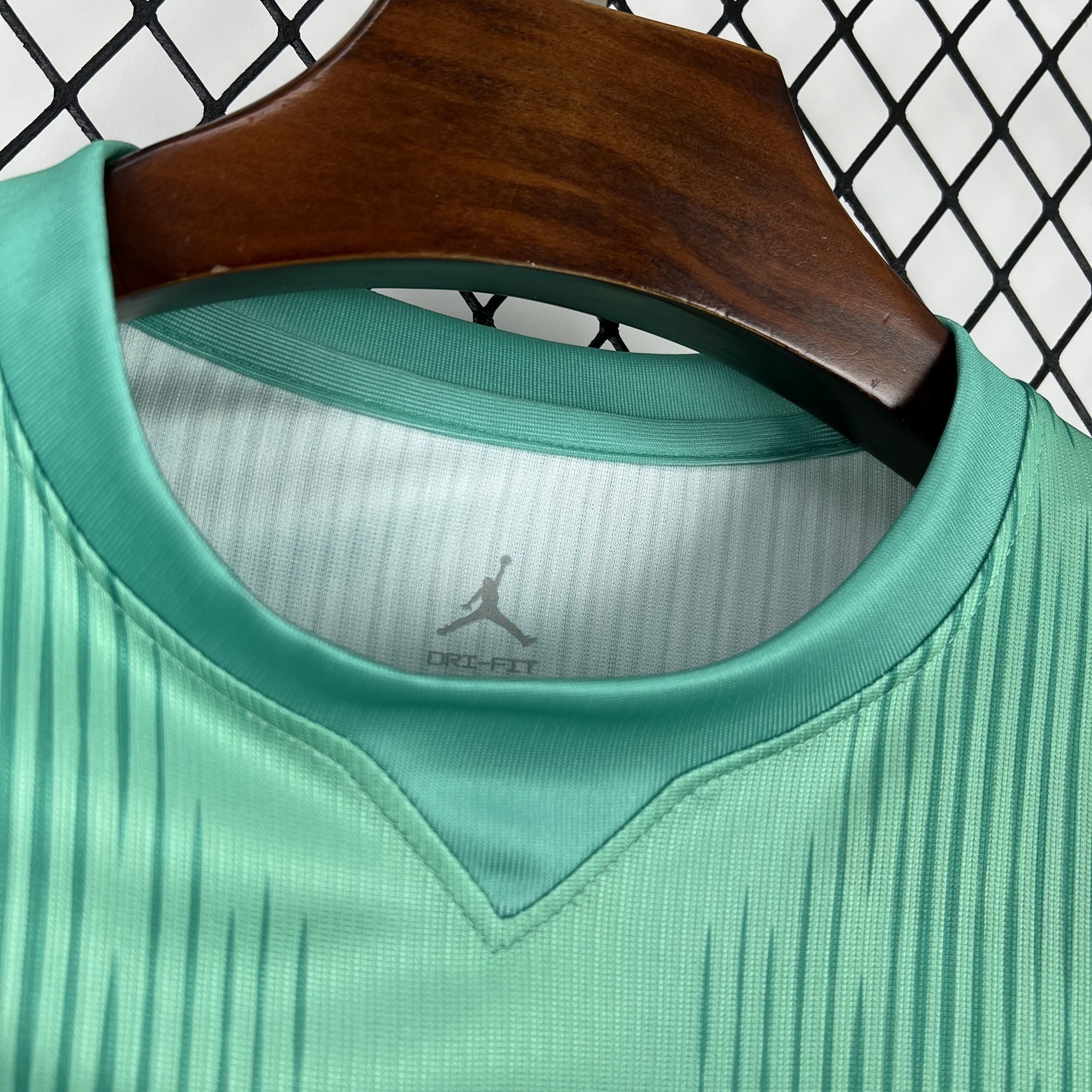 Leazofoot BRÉSIL 2026 goalkeeper jersey in mint green with vertical stripe pattern and Jordan logo.