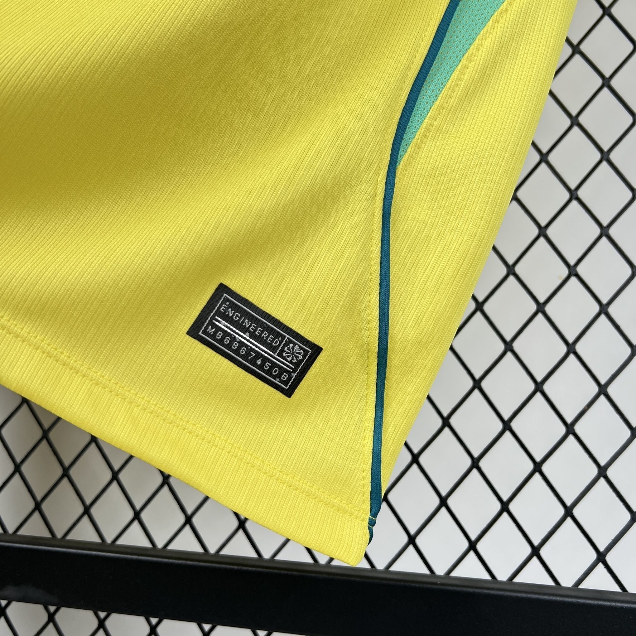 Leazofoot BRÉSIL 2026 home jersey, bright yellow with teal trim and engineered tag.