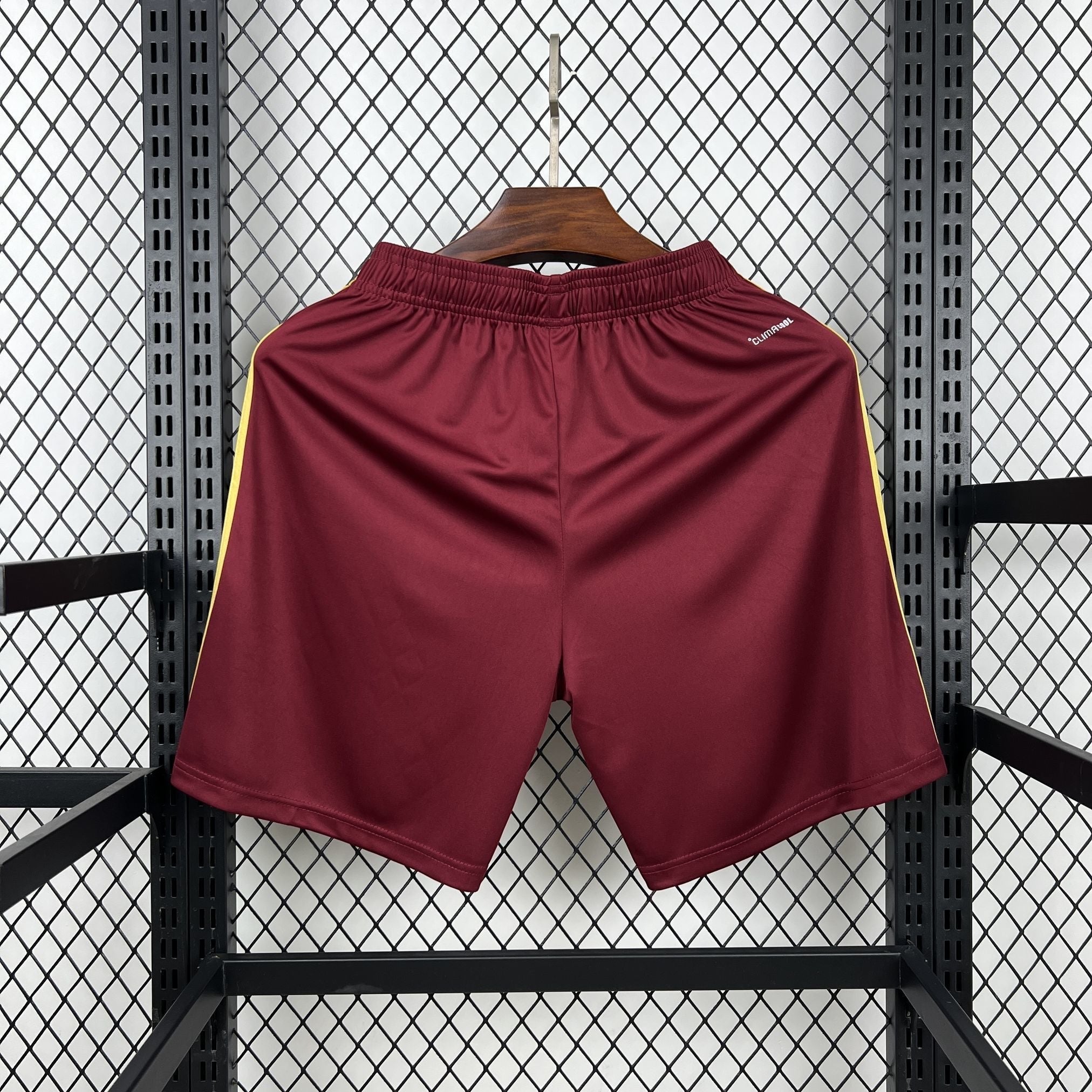 Leazofoot burgundy soccer shorts with yellow side stripes and elastic waistband.