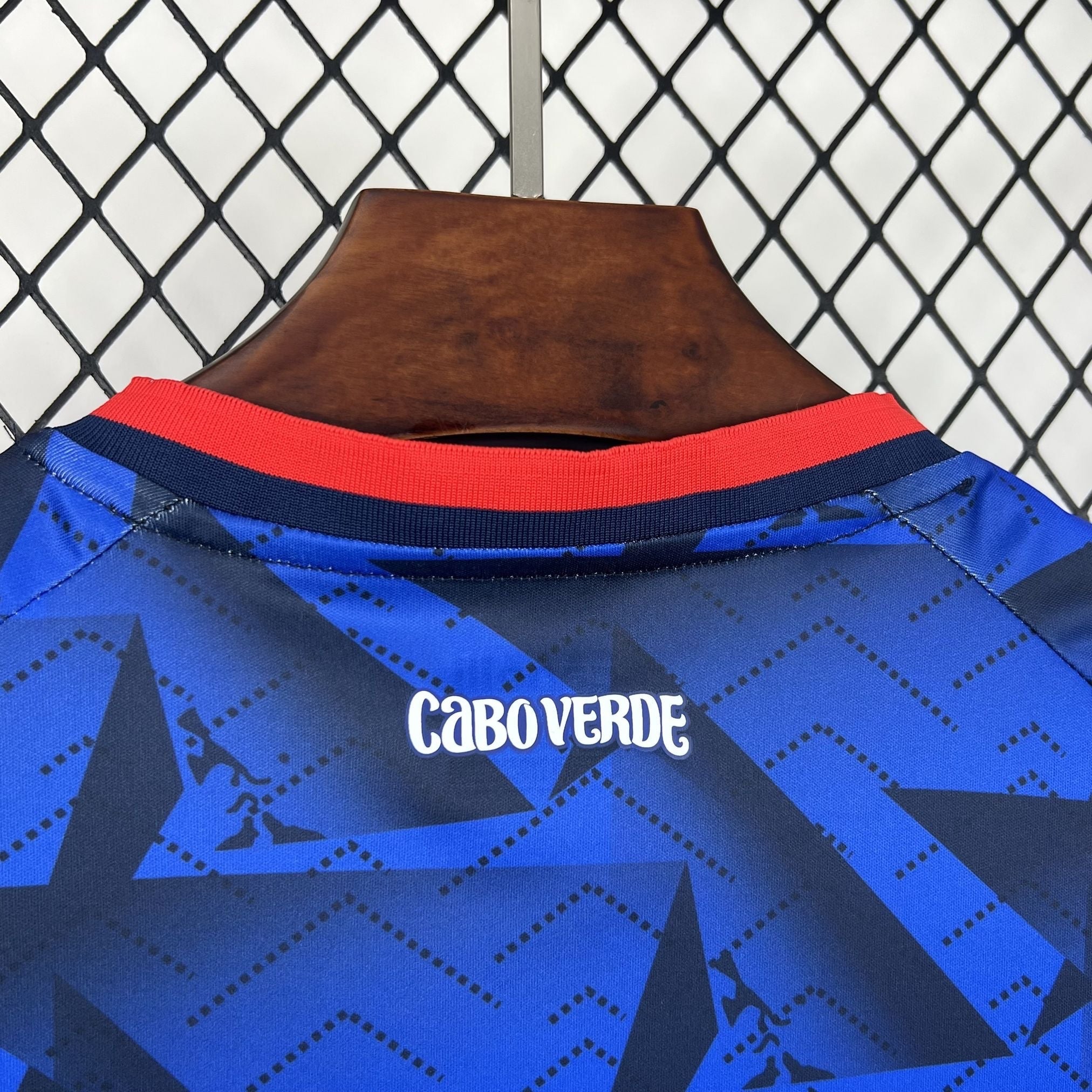 Leazofoot blue and dark blue patterned soccer jersey with red and navy collar detail. Features "CABOVERDE" text on back.