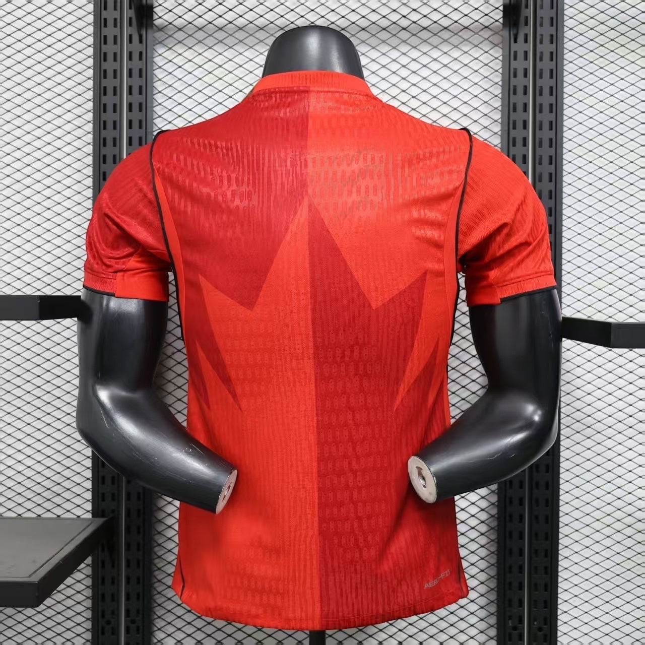 Leazofoot Canada Soccer Jersey: Vibrant red, short-sleeve jersey with a split maple leaf graphic. Lightweight, breathable fabric.