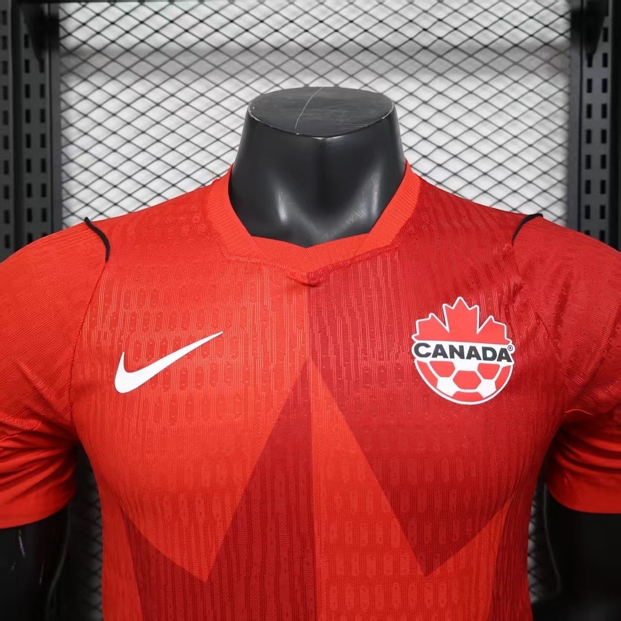 Leazofoot Canada Soccer jersey in red with maple leaf graphic, Nike Swoosh, and Canada Soccer crest. Lightweight, breathable fabric.