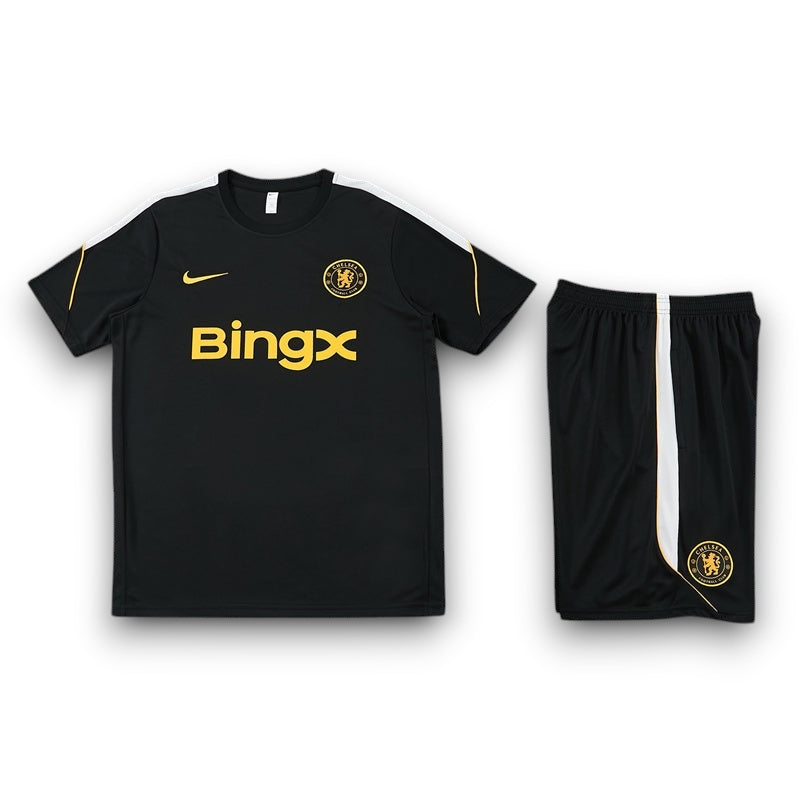 Leazofoot Chelsea 26/27 black training kit with gold accents, white side stripes, and team crest on shirt and shorts