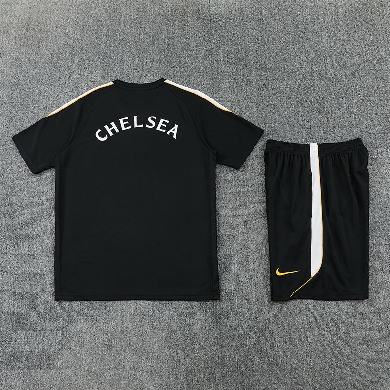 Leazofoot Chelsea 26/27 black training kit with white and gold accents, including jersey and matching shorts.
