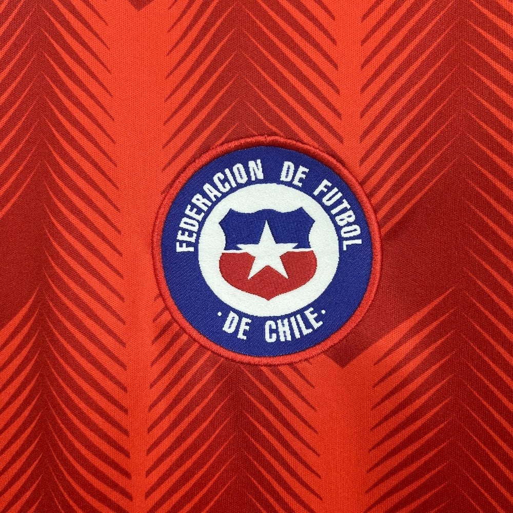 Leazofoot Chile 2026 home soccer jersey featuring a red fabric with a textured chevron pattern and team crest.