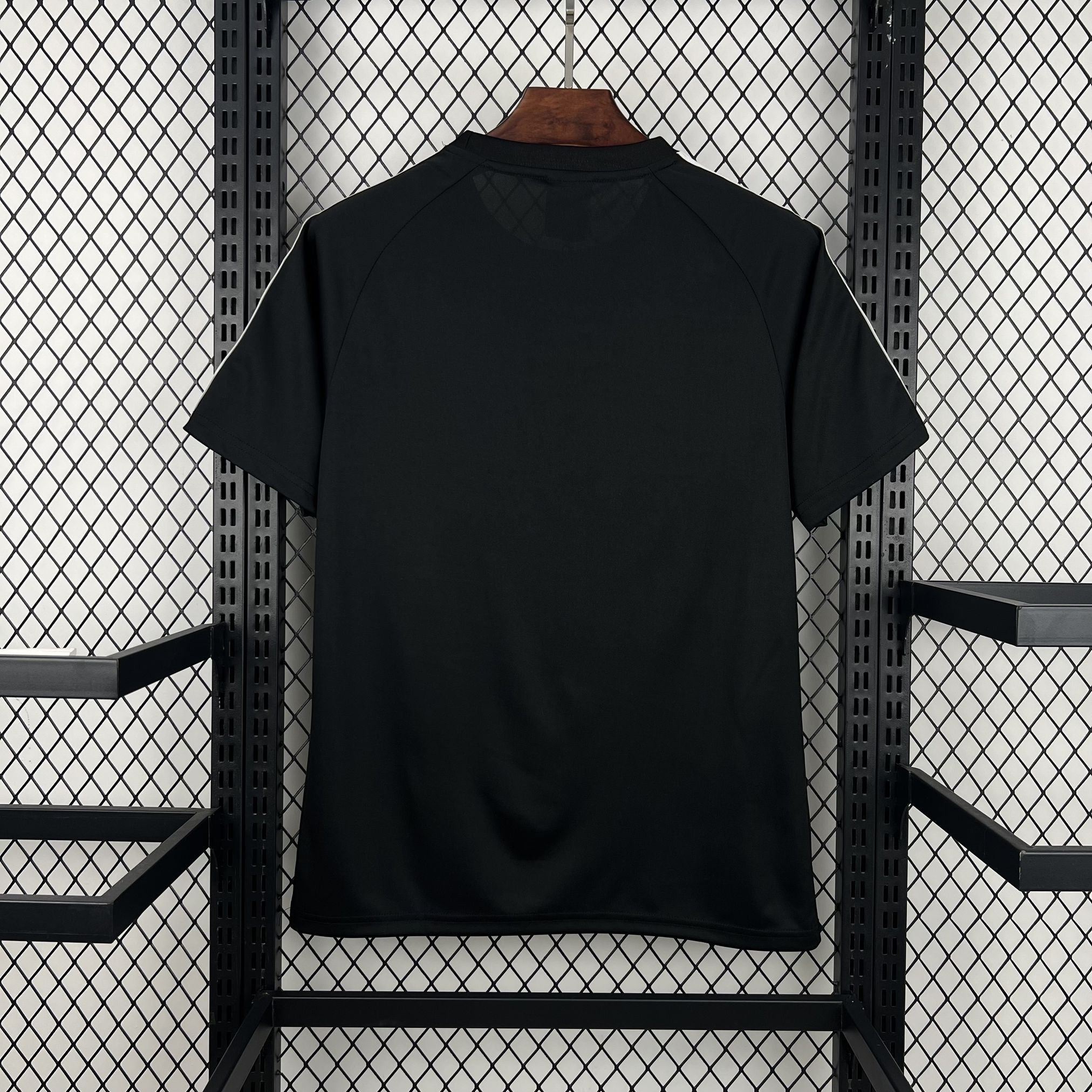 Back view of Leazofoot CHILI 2026 concept football jersey in solid black with white shoulder piping.