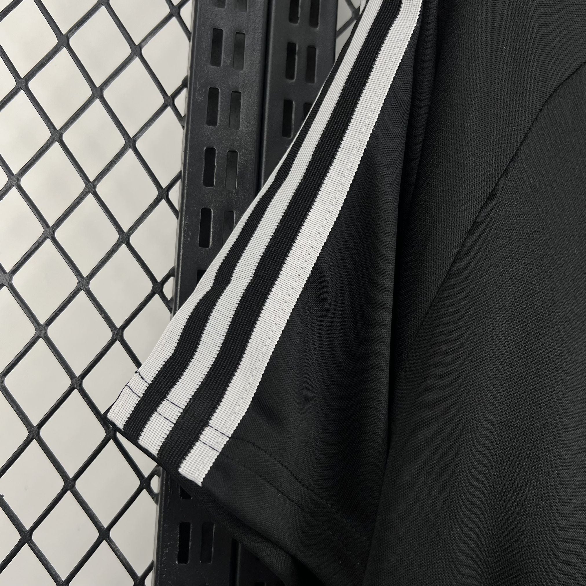 Leazofoot Chili 2026 concept football jersey in black with white striped sleeve detailing.