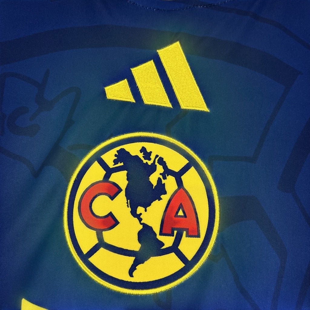 Leazofoot Club América 26/27 away jersey in blue with yellow embroidered team crest and adidas logo detail.
