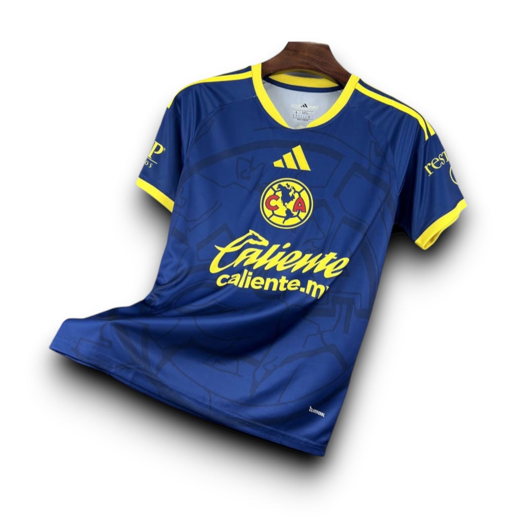 Leazofoot Club América 26/27 away soccer jersey in blue with yellow accents, team crest, and sponsor logos.