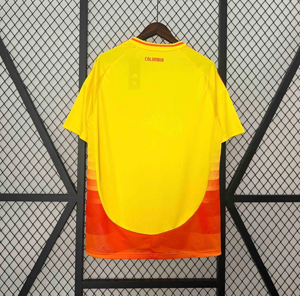 Back view of the Leazofoot Colombia 2024 home soccer jersey in yellow with orange gradient hem and Colombia text.