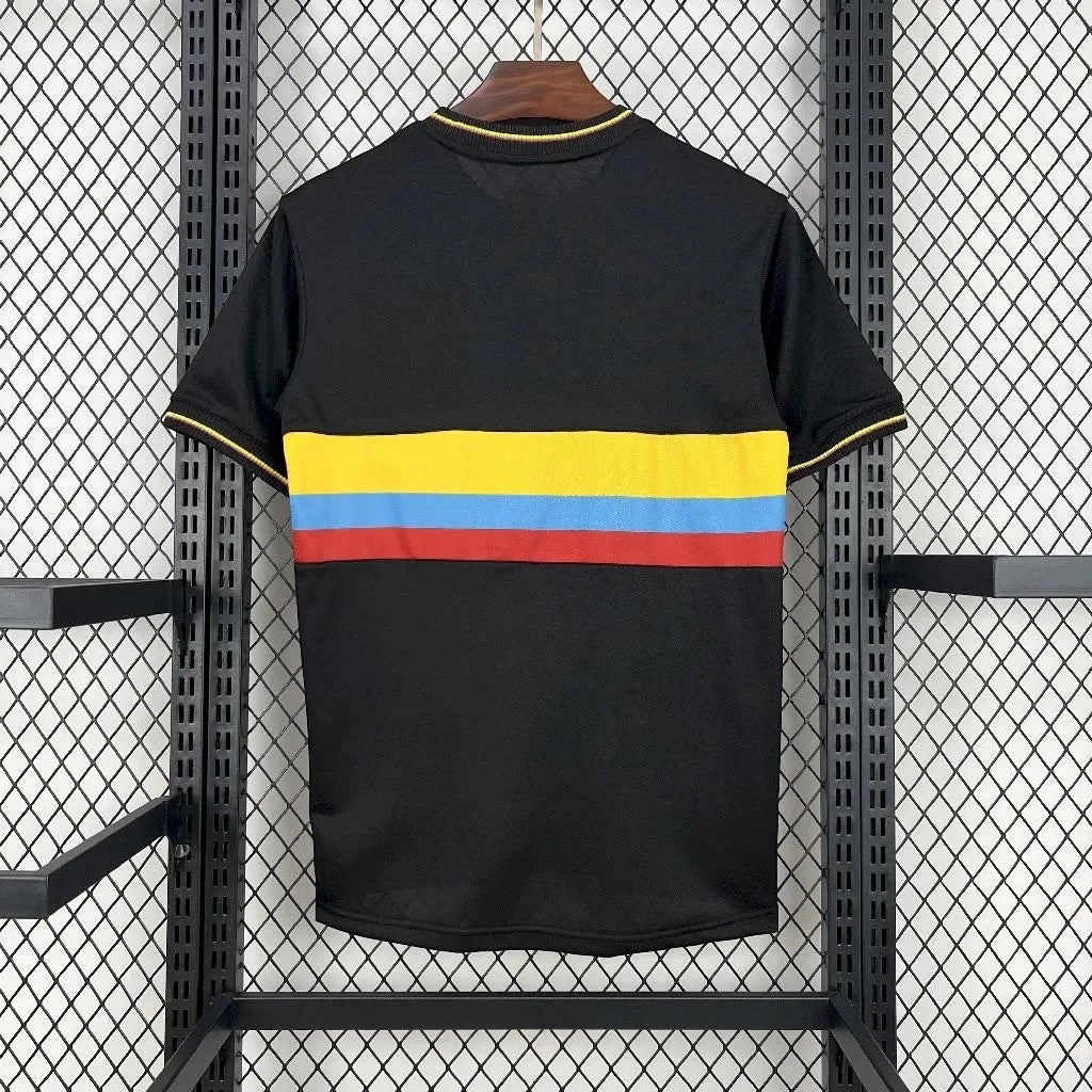 Leazofoot Colombia 24/25 football jersey in black with yellow, blue, and red horizontal chest stripes.