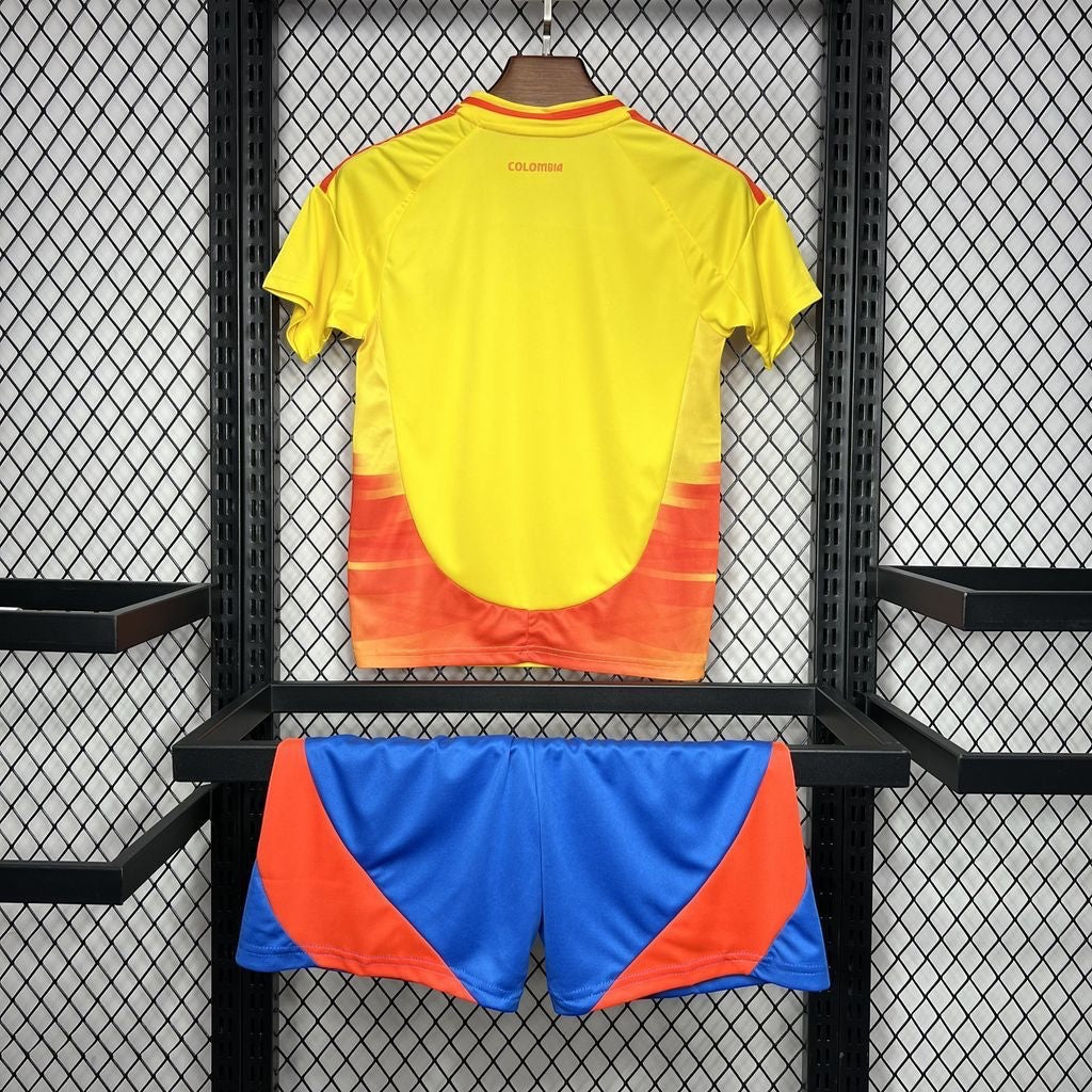 Leazofoot Colombia home jersey in yellow with orange accents and matching blue and orange athletic shorts.