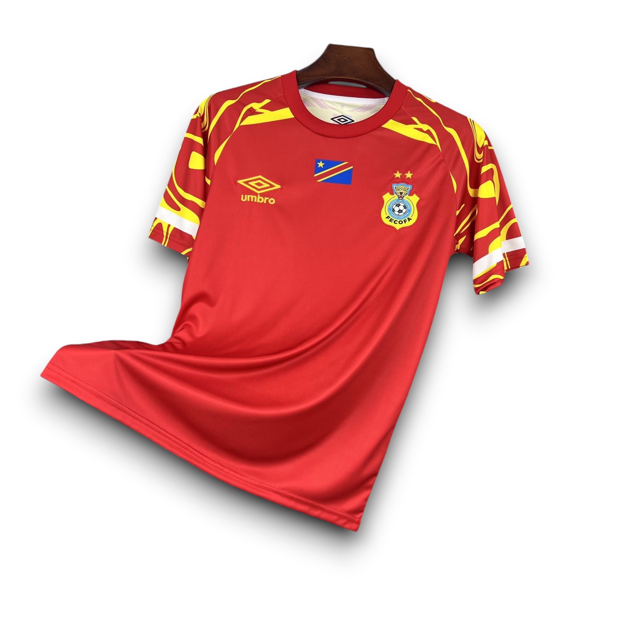 Leazofoot CONGO 2026 third football jersey. Red with yellow abstract pattern on sleeves and shoulders.
