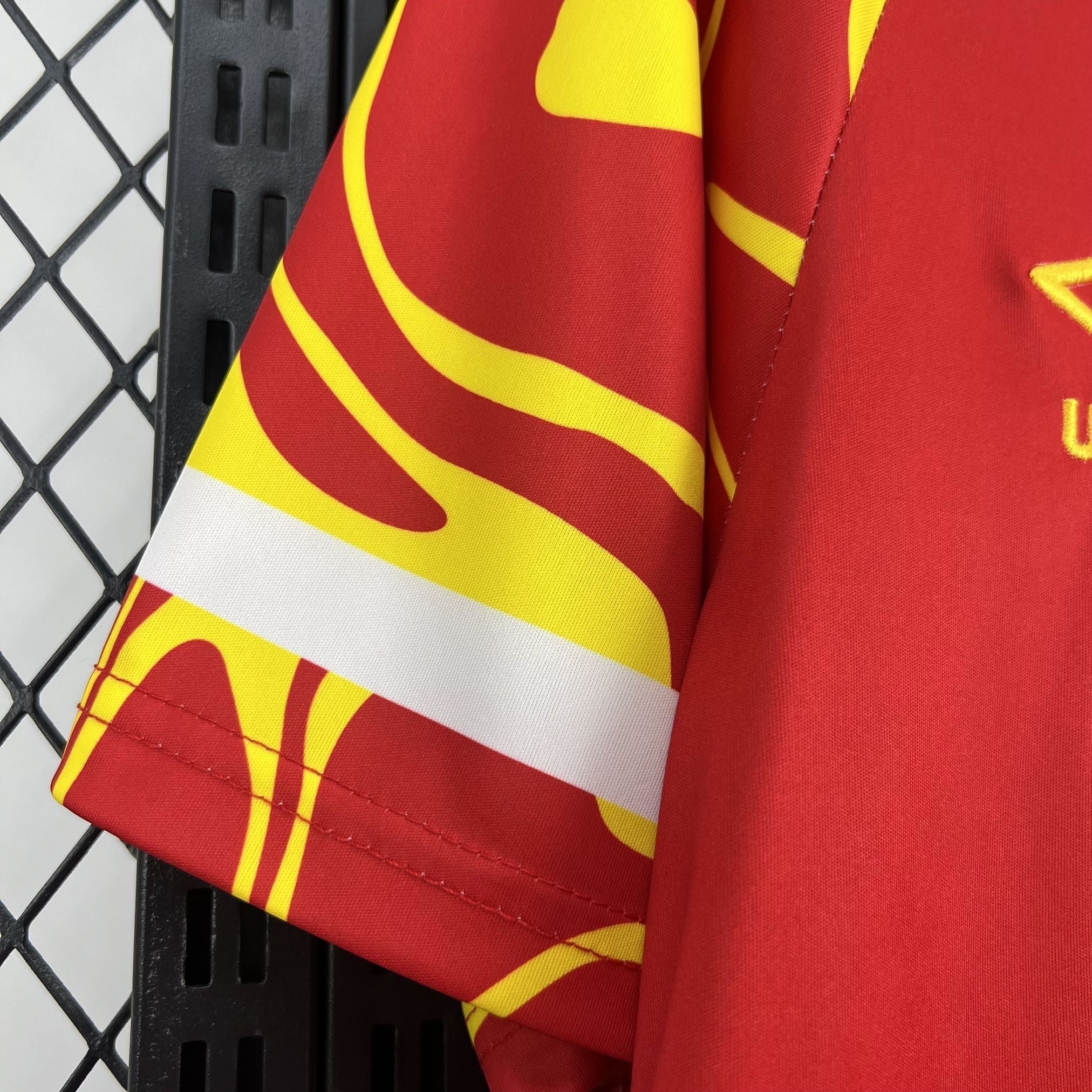 Leazofoot CONGO third football jersey 2026, red with yellow wavy pattern and white sleeve stripe.