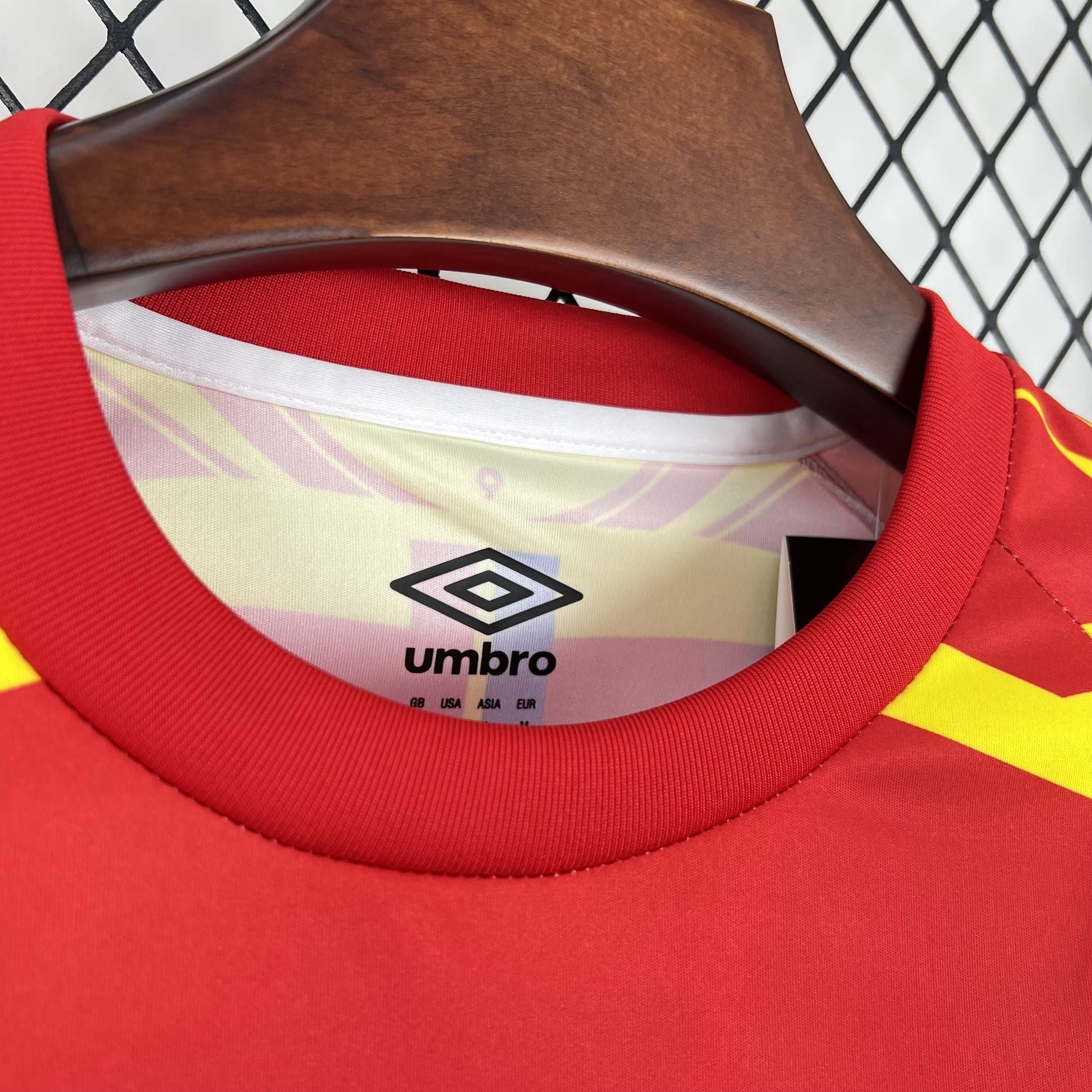 Leazofoot CONGO third football jersey 2026, red with yellow accents, crew neck, short sleeves, Umbro logo.