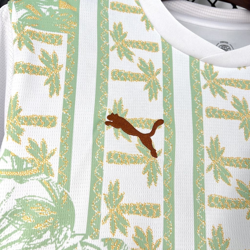 Leazofoot Côte d'Ivoire 2026 away jersey in white with green palm tree patterns and a brown embroidered Puma logo.