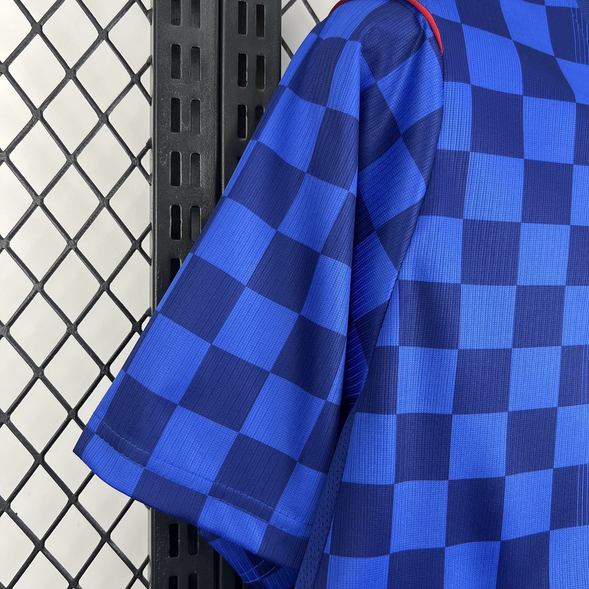 Leazofoot blue and navy checkered short-sleeve soccer jersey with red trim