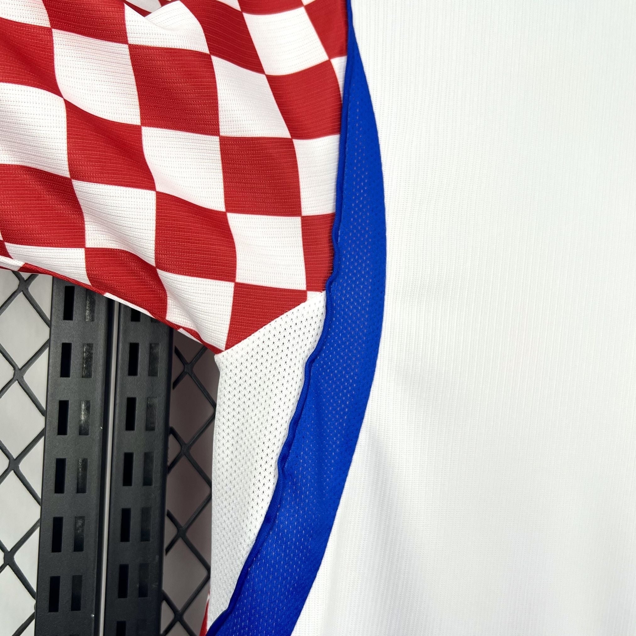 Leazofoot Croatia home soccer jersey 2026 with red and white checkerboard pattern on sleeve and blue trim.