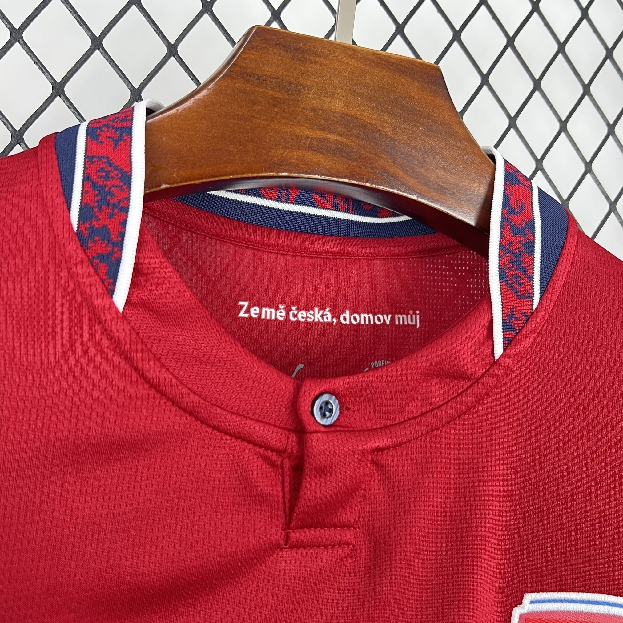 Leazofoot Czech Republic 2026 home football jersey in red with blue and white trim on the collar. Features a button placket.