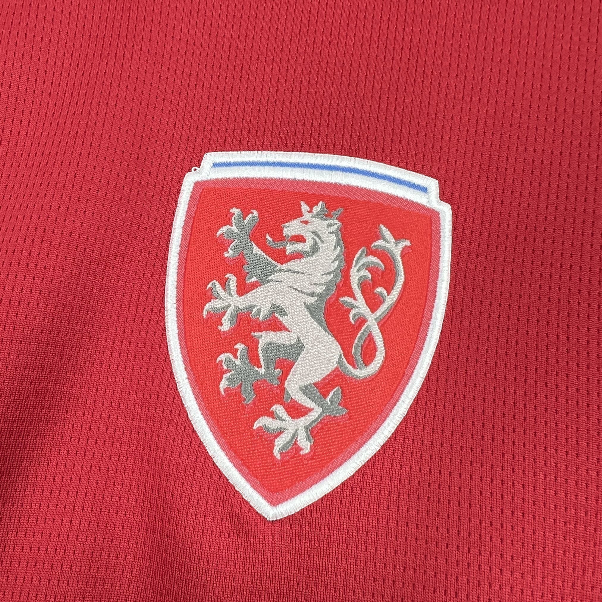 Leazofoot Czech Republic 2026 home jersey with embroidered lion crest on red textured fabric.