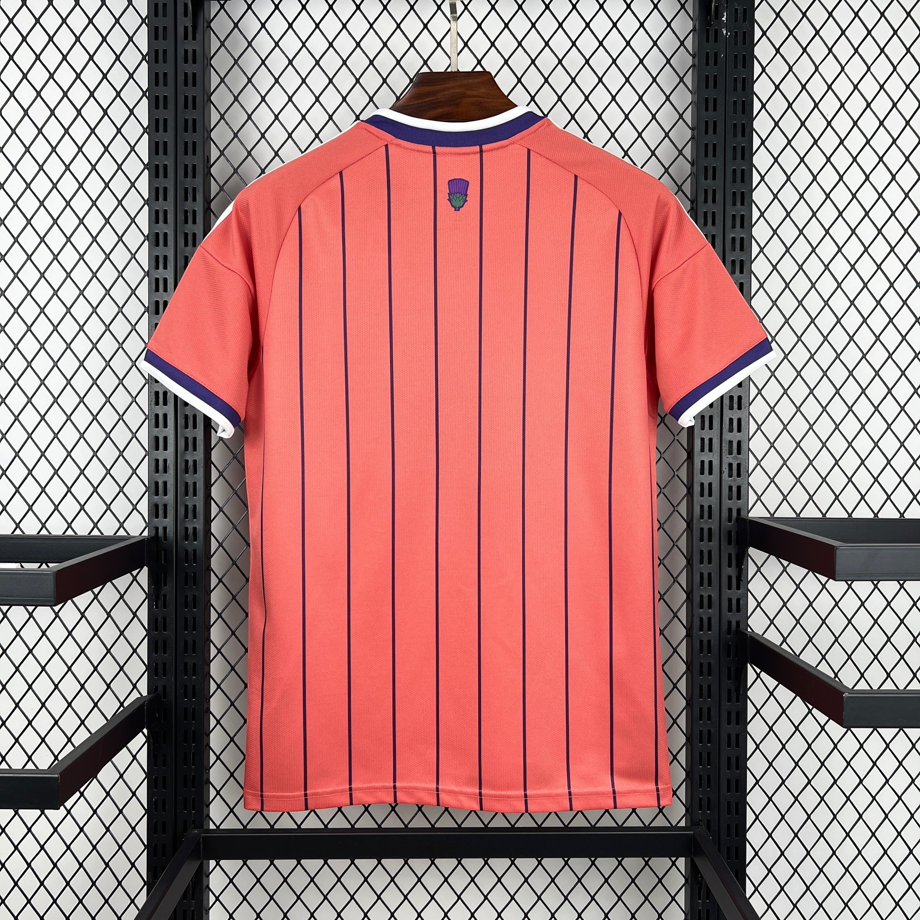 Leazofoot ÉCOSSE 2026 away jersey in coral with navy pinstripes and white/navy trim on collar and sleeves.
