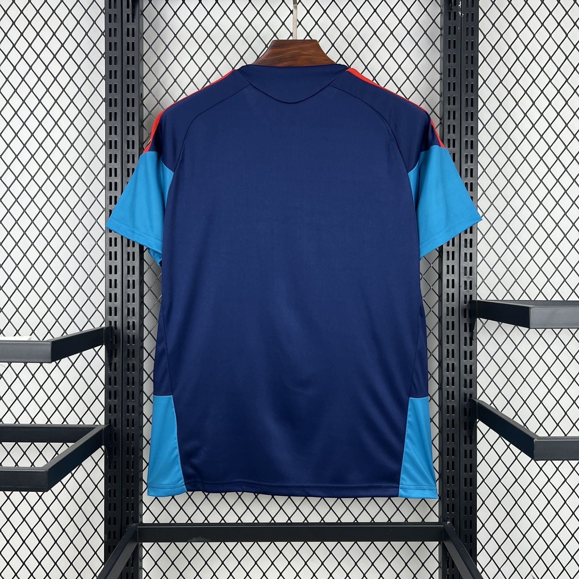 Leazofoot ESPAGNE 2026 pre-match jersey, navy blue with light blue and red accents on sleeves and sides.
